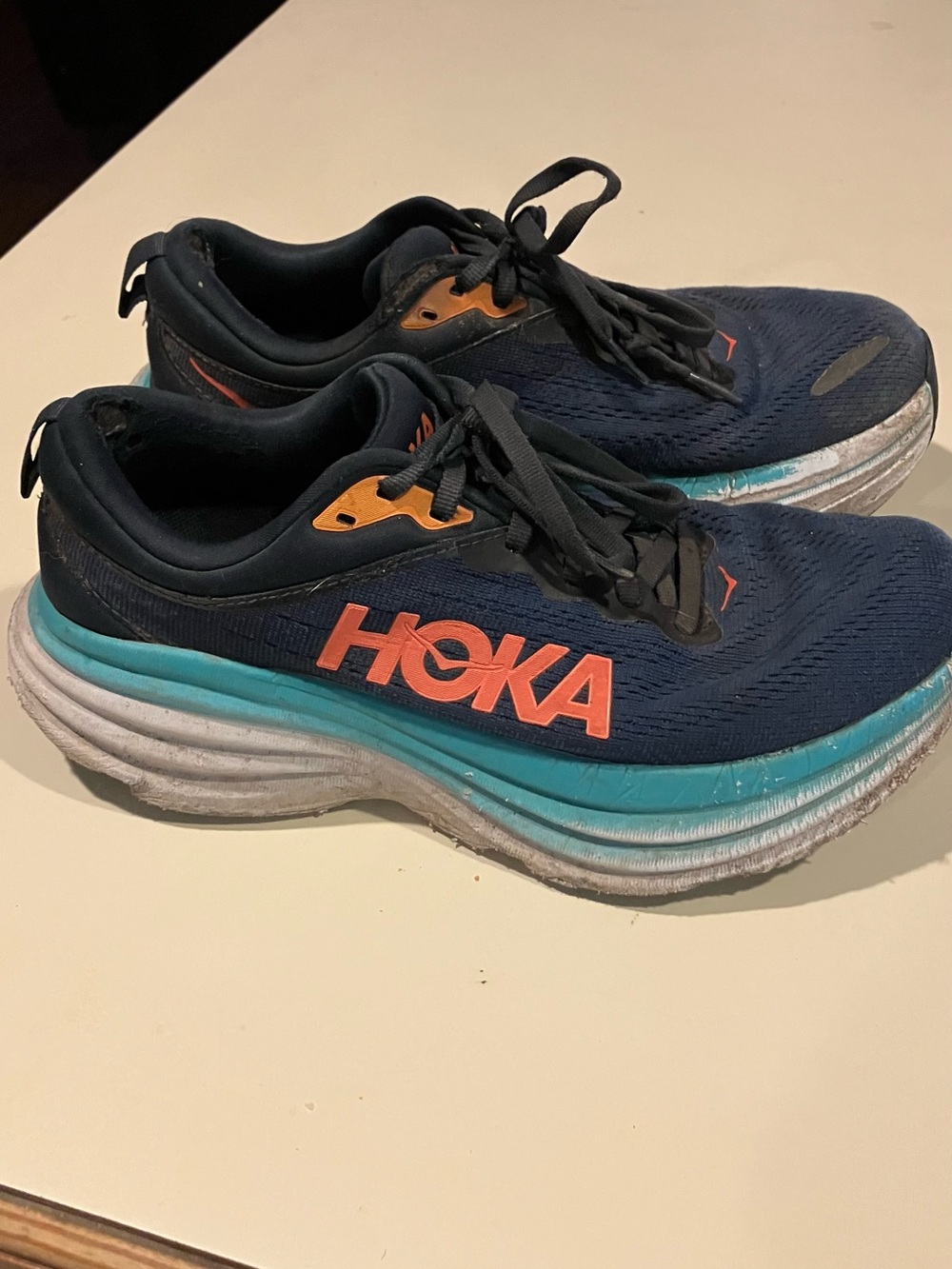 Hoka Women's Navy Running Shoes with Teal Midsole and Orange Accents